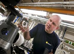 Beamline scientist Fred Mosselmans examining a fragment of the Mary Rose